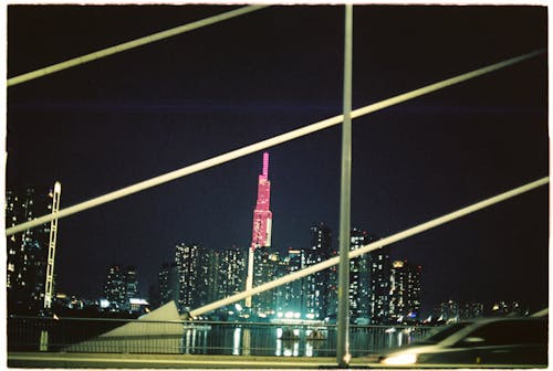 A bridge with a city skyline in the background