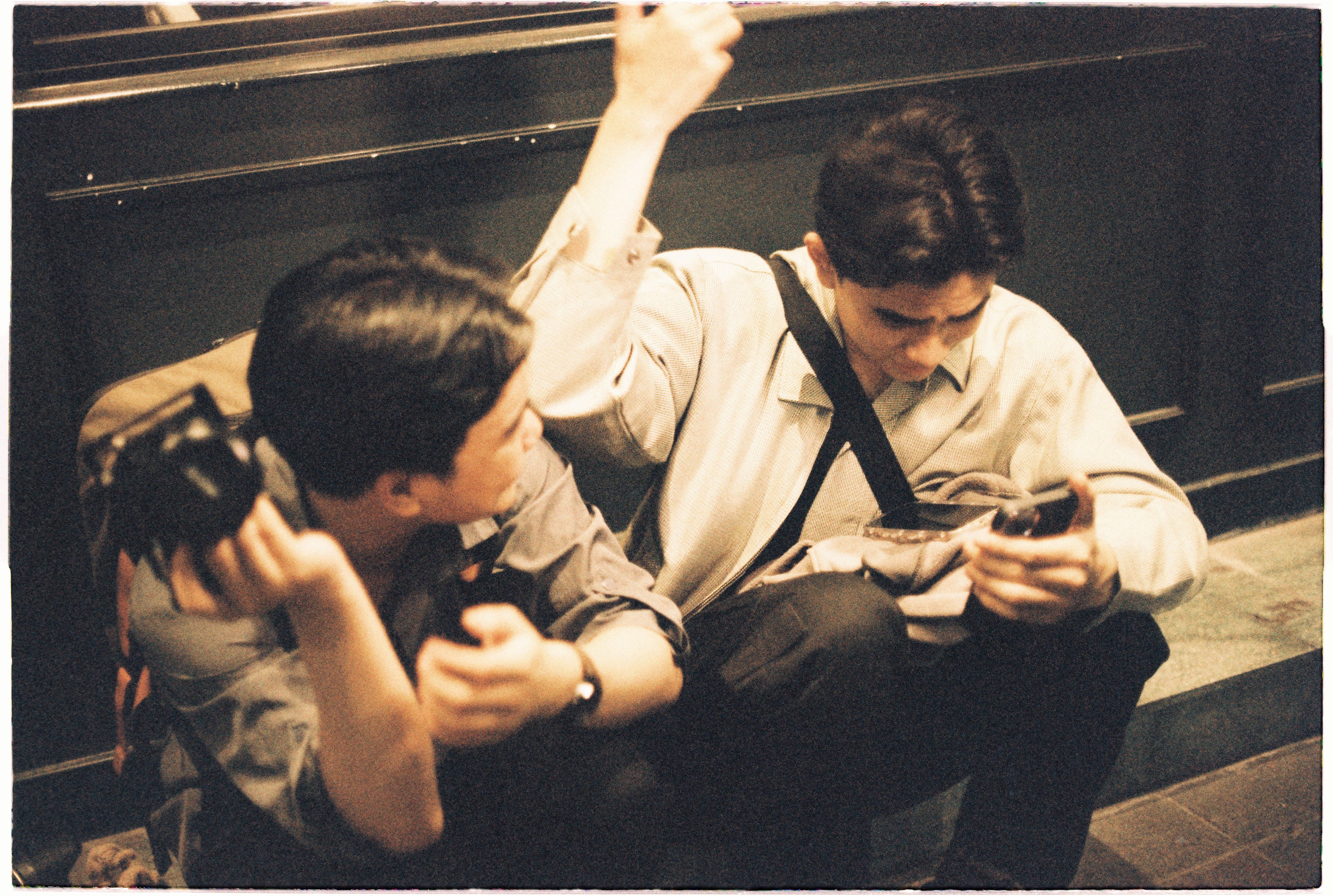 Two men sitting on a bench · Free Stock Photo
