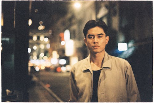 A man standing in the middle of a city street