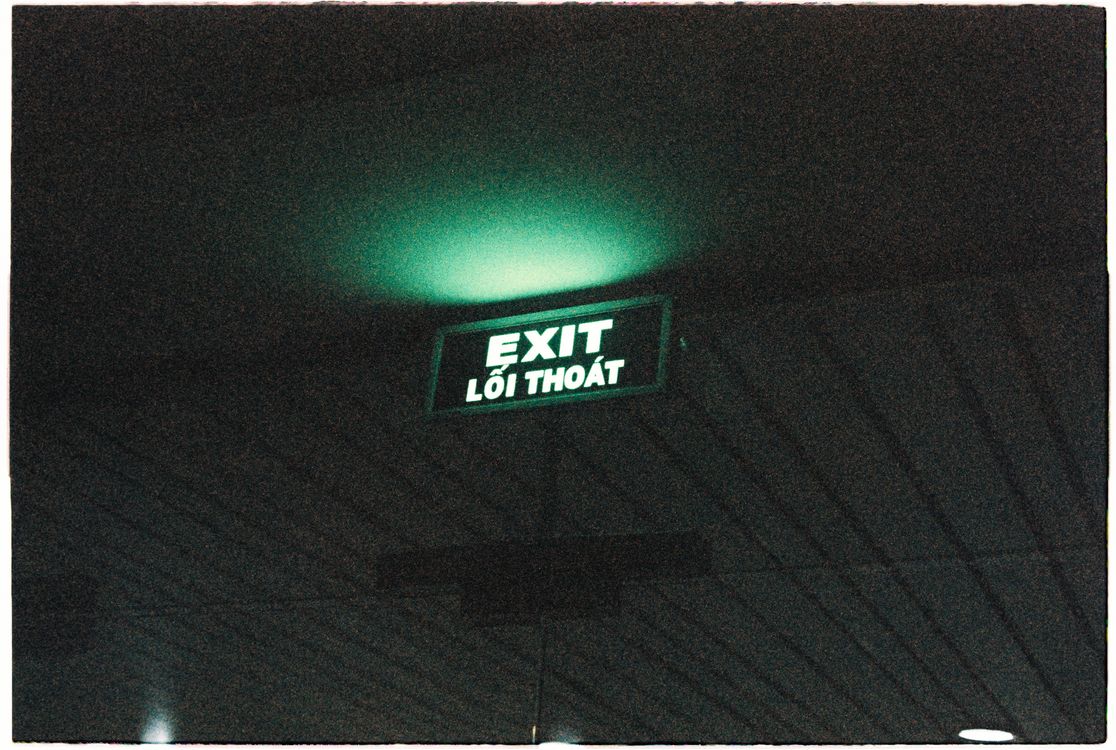 Illuminated Exit Sign in a Subway · Free Stock Photo