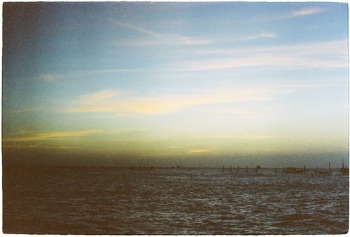 Free Peaceful ocean landscape at dusk, capturing a serene horizon with subtle sunset hues. Stock Photo