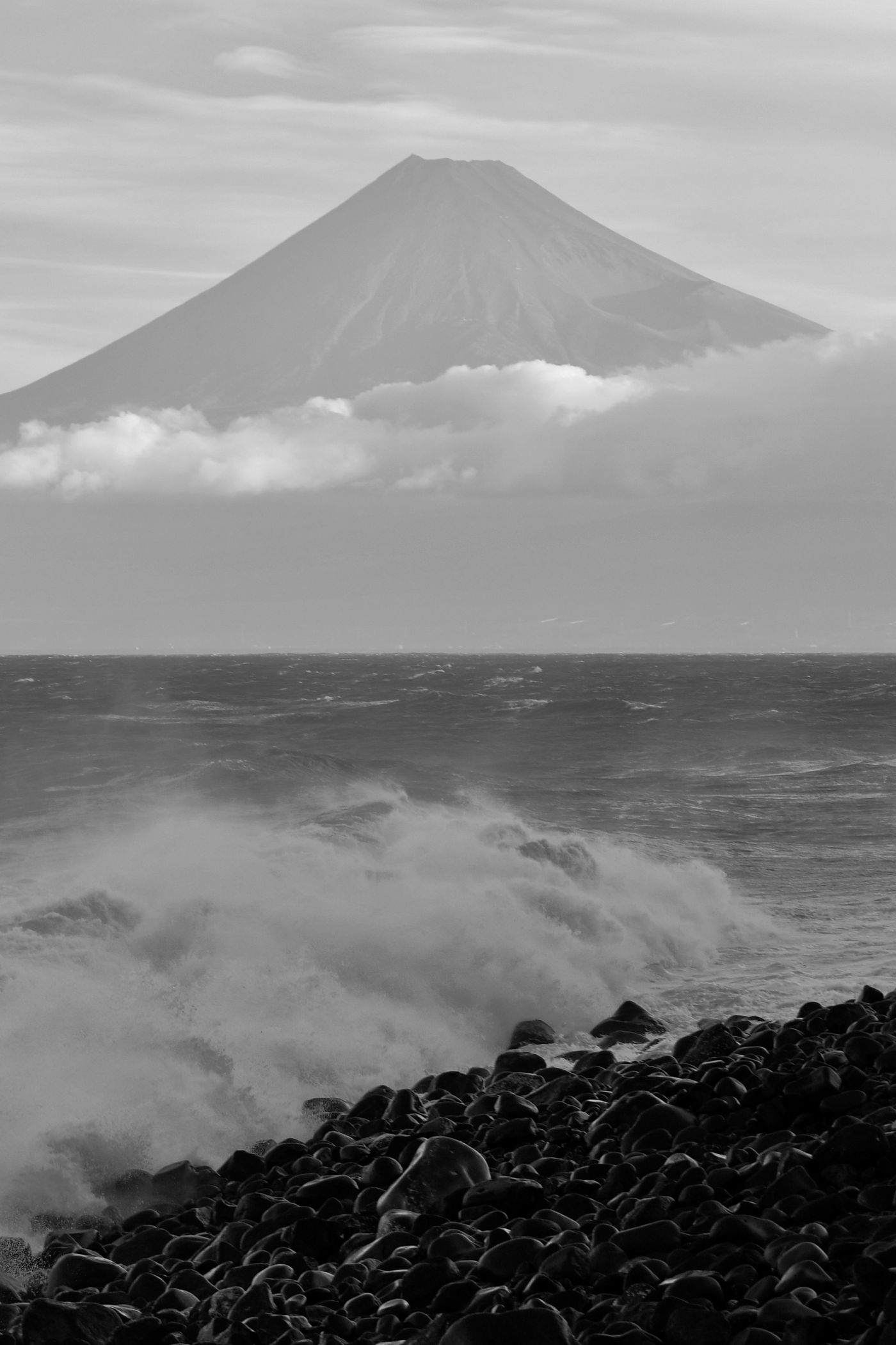 A volcano rising over the seashore