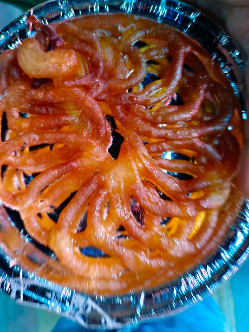 Free Jalebi khane me apna hi mja hai  Stock Photo