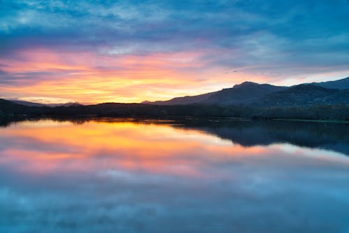 Безкоштовне стокове фото на тему «Захід сонця, краєвид, озеро»