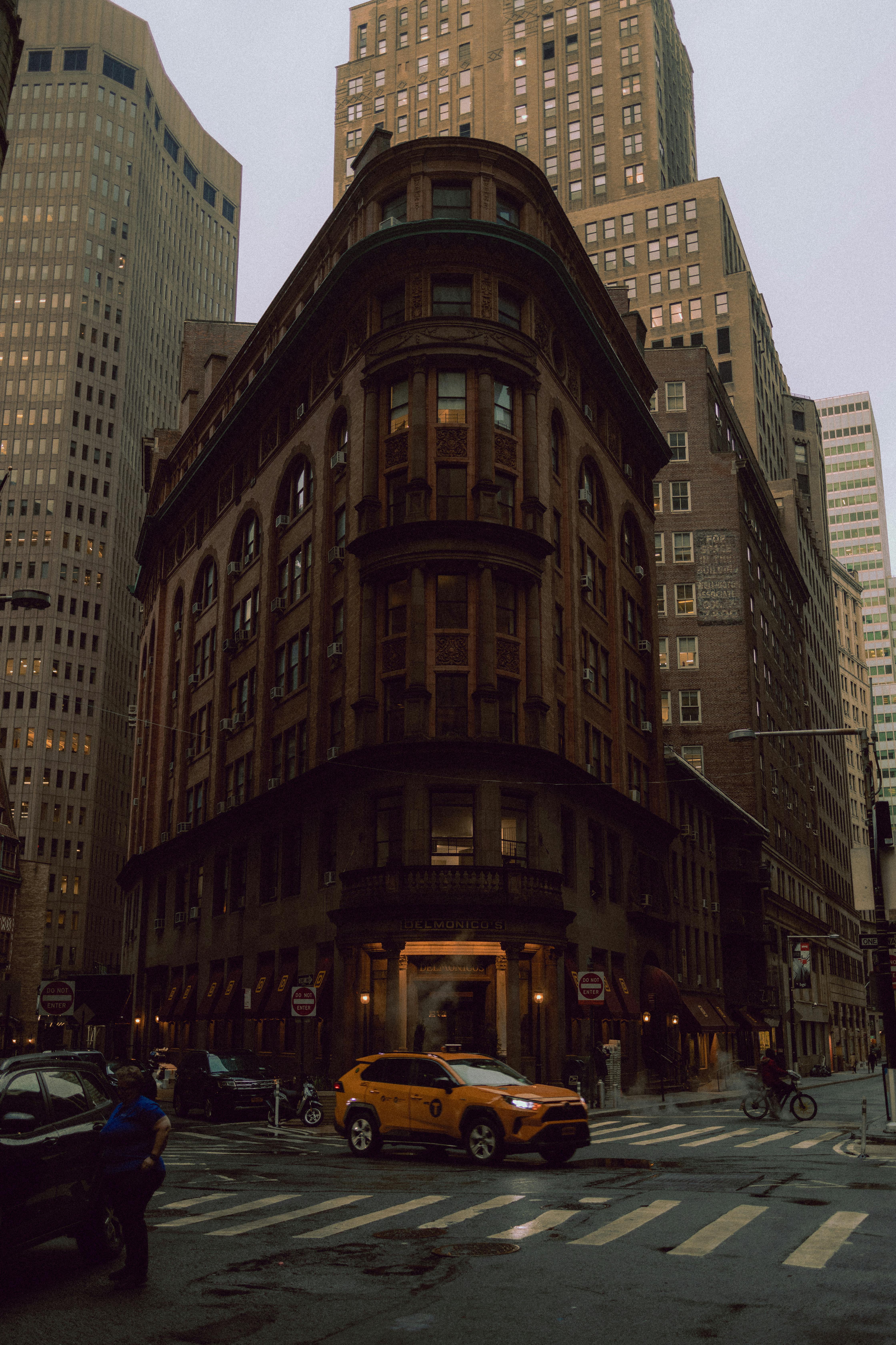 A classic view of New York's urban architecture with a taxi on the street.