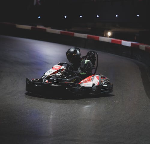 A person riding a go kart on a track
