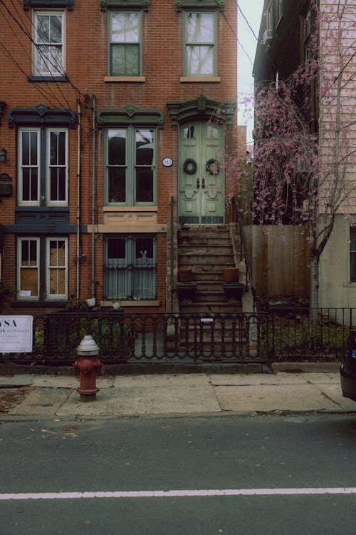 A fire hydrant is in front of a building