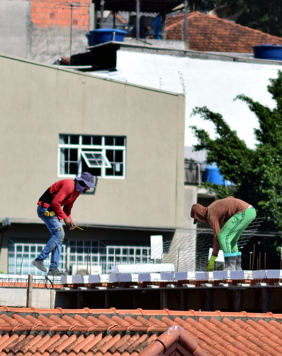 Copperline roofer inspecting a rooftop at work