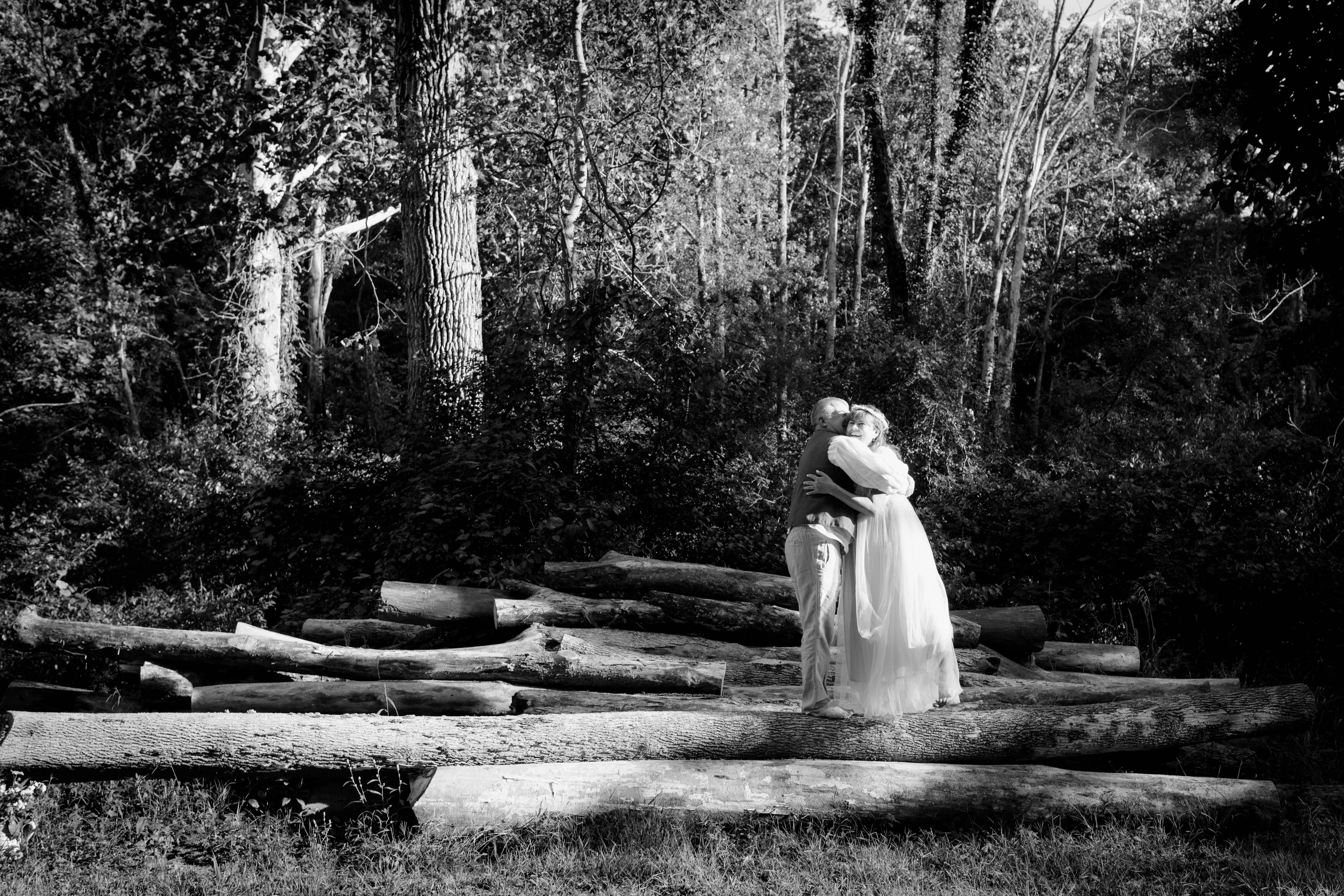 Elderly Couple Hugging in a Forest in Black and White · Free Stock Photo