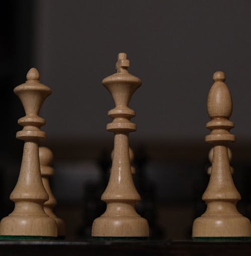 Chess pieces are lined up on a table