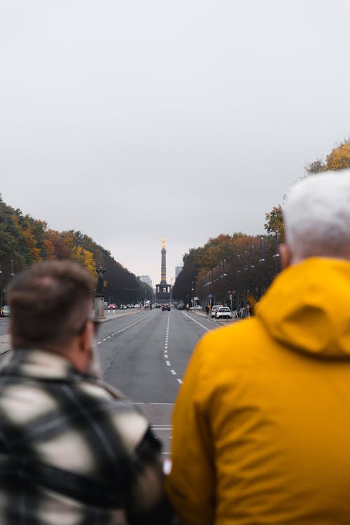 Two people looking at the monument in the distance