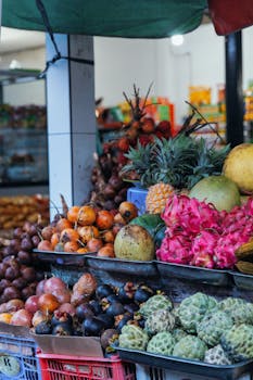 A vibrant selection of exotic fruits on display at an open market stand.