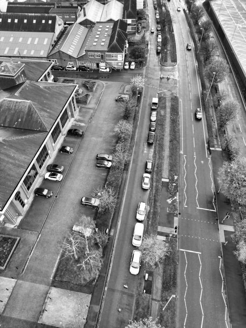Free High-angle view of a street in Hertfordshire, England, showcasing parked cars and buildings. Stock Photo