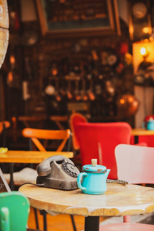 A coffee cup and a pair of shoes on a table