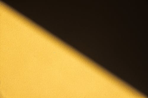 Free Yellow Wall With A Shadow Stock Photo