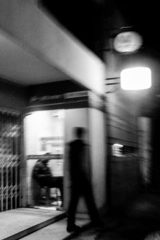 Blurred black and white photo of urban night scene in Dhaka, Bangladesh.