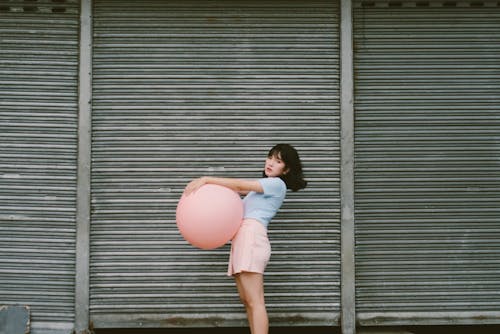 Woman Holding Pink Balloon