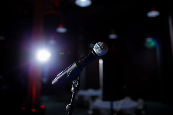Microphone on a stage under a spotlight — photo by Katrien Grevendonck on Pexels