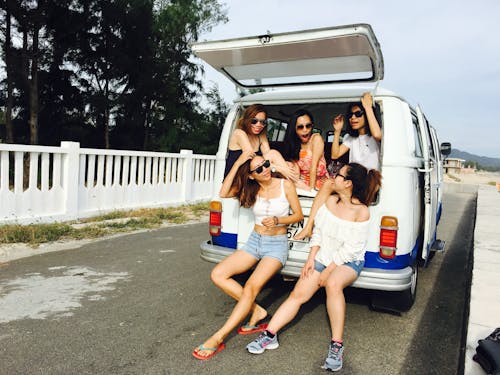 Free Photo of Five Women Sitting in Back of Van Stock Photo