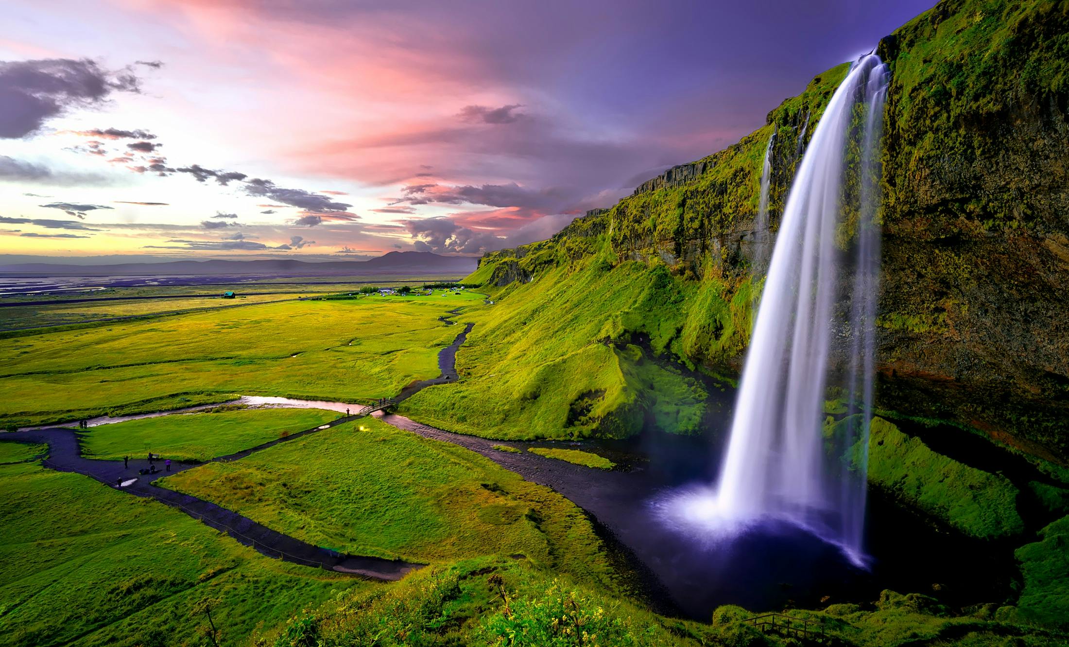 time lapse photography of waterfalls during sunset