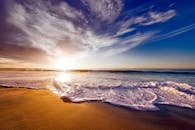 Seashore Under White and Blue Sky during Sunset