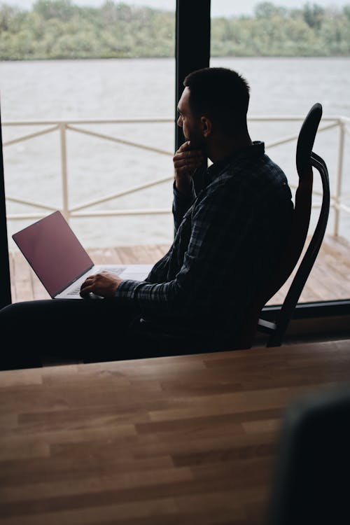 Free Man Sitting on Chair Stock Photo