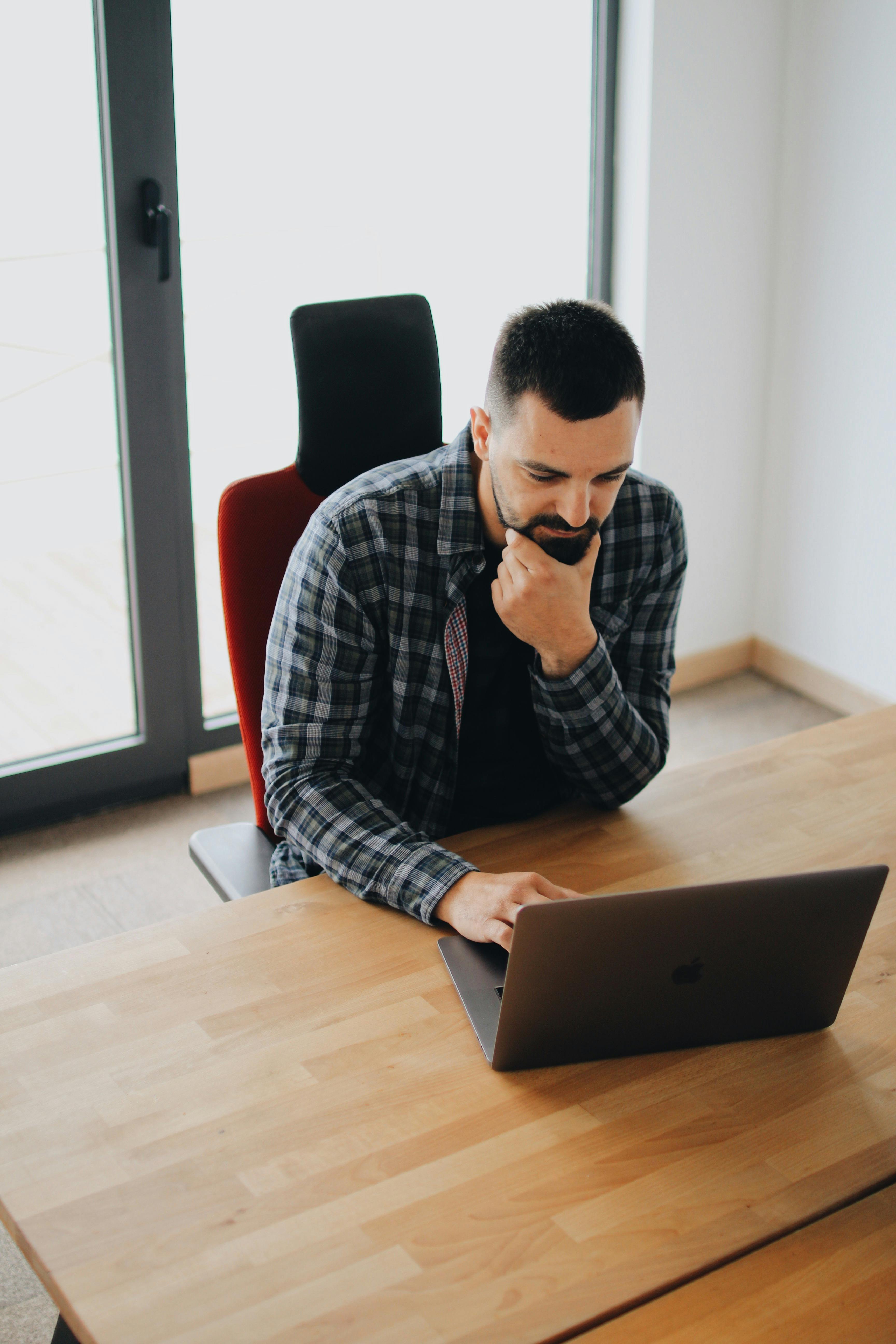 man using laptop computer