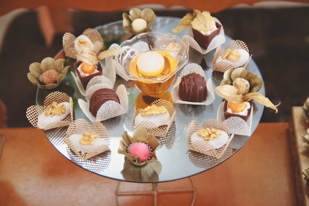 Crowd at a nighttime music festival raising hands toward the stage