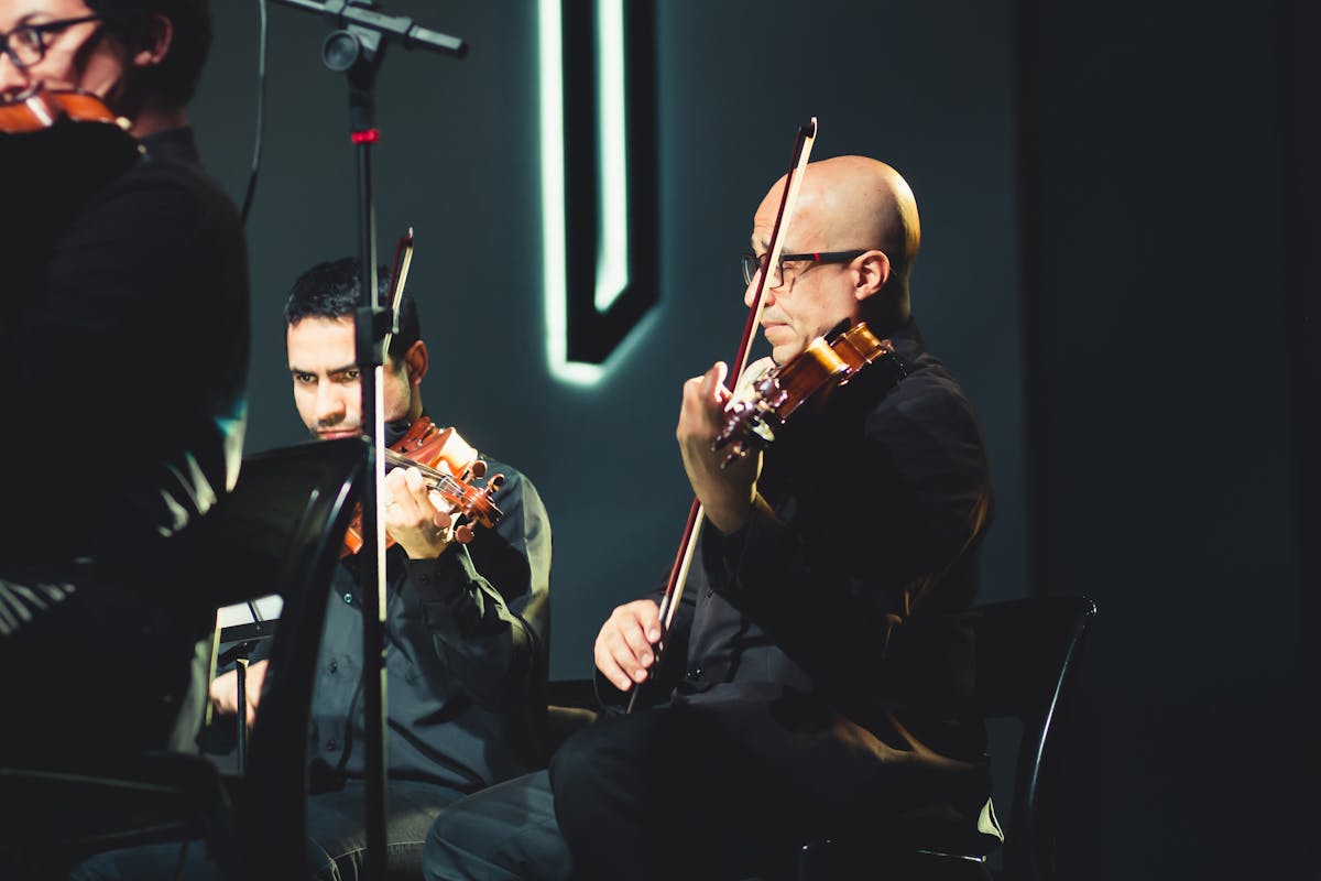 Microphone on stage under concert lights symbolizing live performance