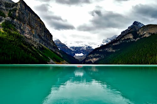 Free Body of Water Surround by Mountains Stock Photo