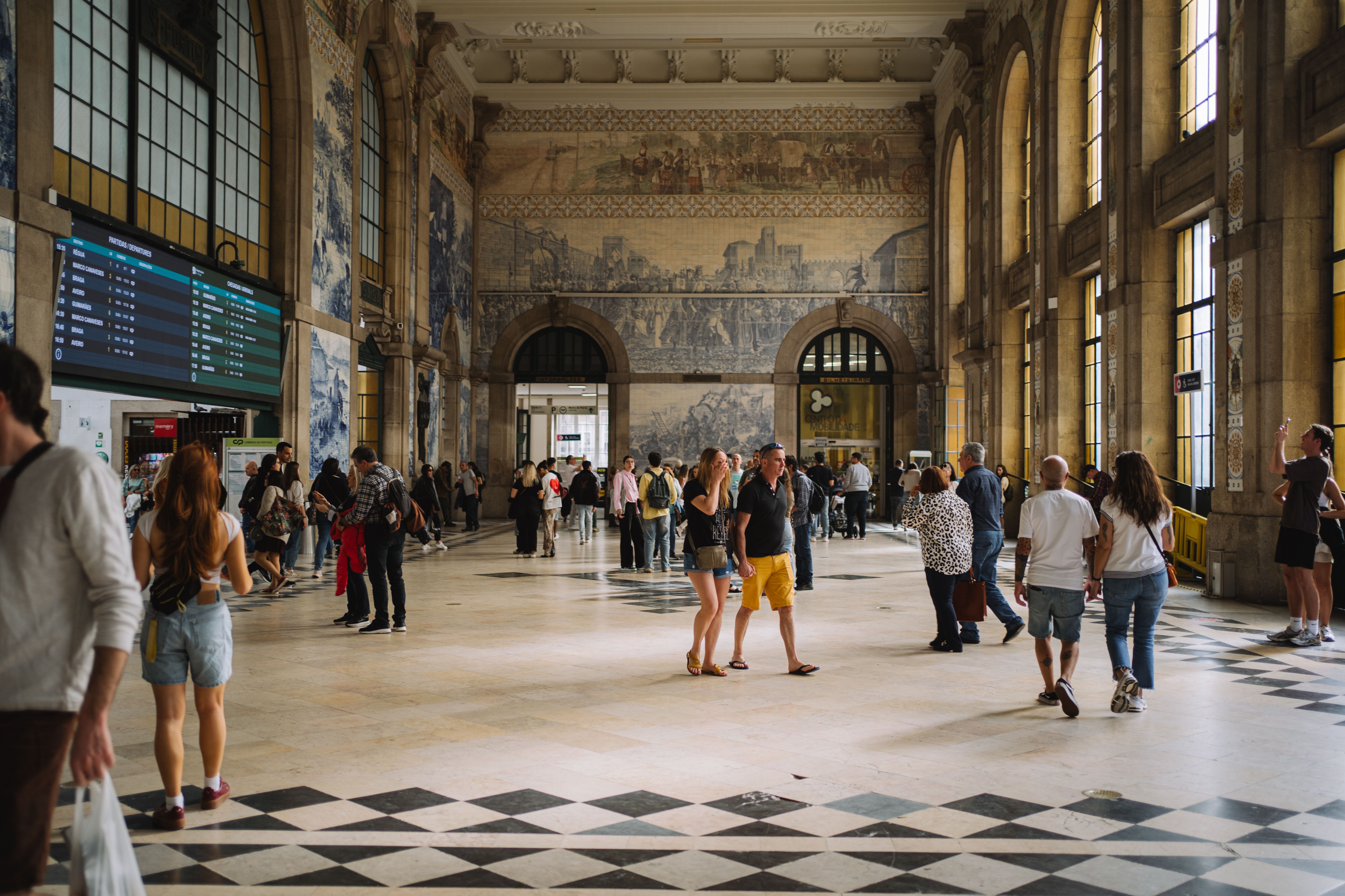 Blue-and-white azulejo tile wall in São Bento station's entrance vestibule, Porto