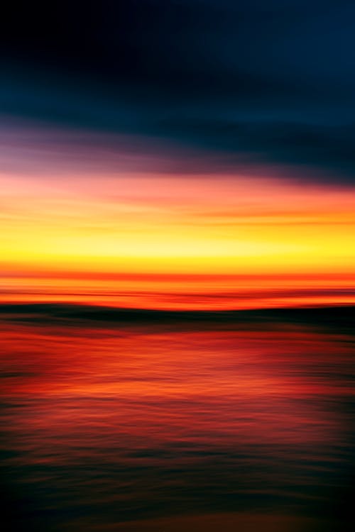 An abstract photograph of a sunset over the ocean