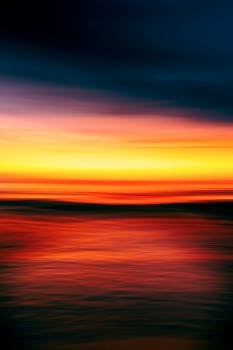 A serene and colorful abstract depiction of a sunset over the ocean, creating a tranquil seascape.
