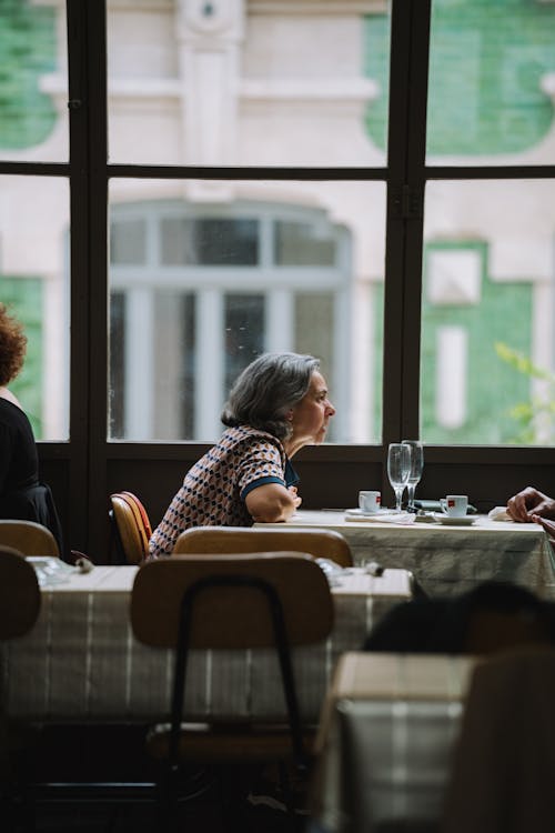 Two people sitting at a table in a restaurant