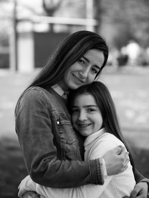 Free Portrait of Smiling Mother and Daughter Stock Photo