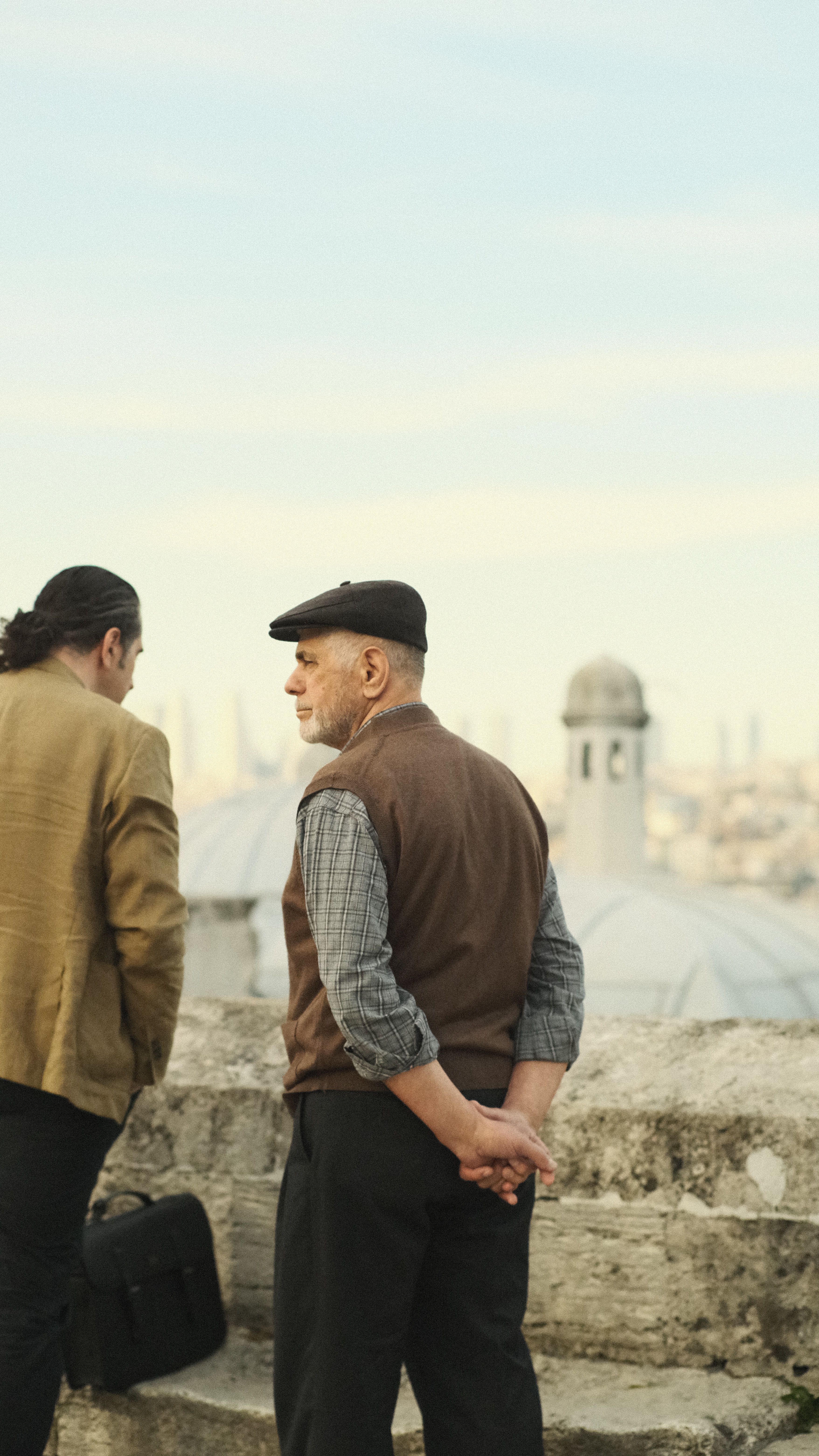Two men enjoying the view near Suleymaniye Mosque, Istanbul, Turkey.
