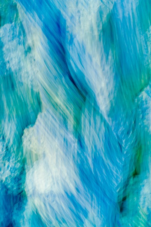 A painting of blue and green water