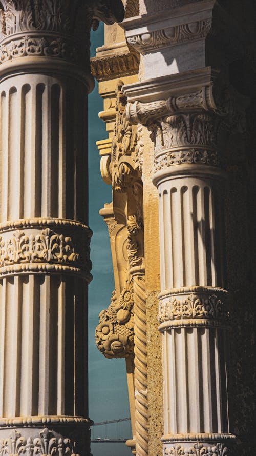 A close up of two columns with ornate designs