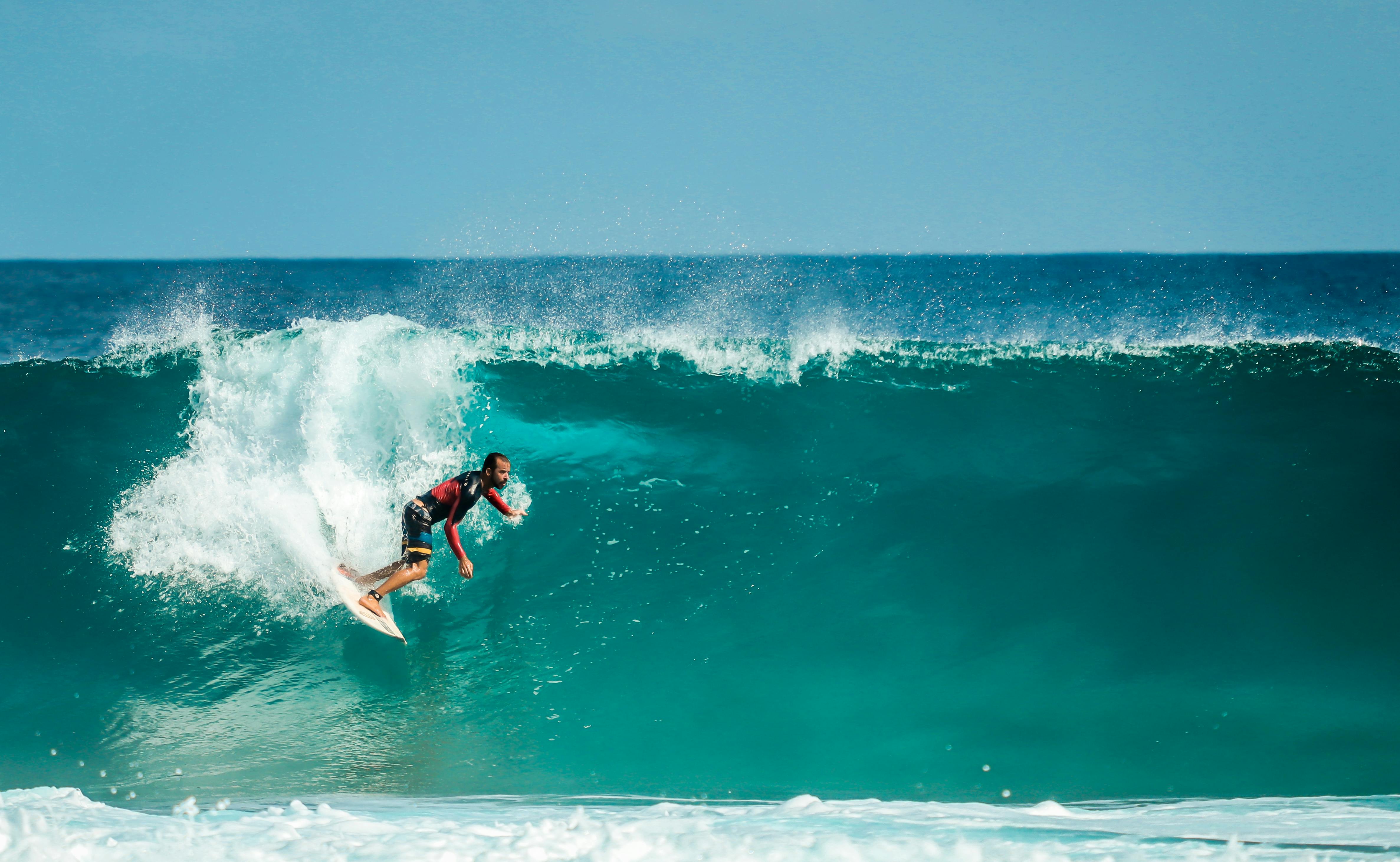 photography of man surfing