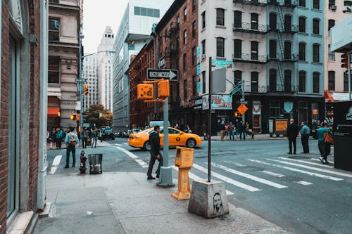 Free People Crossing Busy City Street Stock Photo