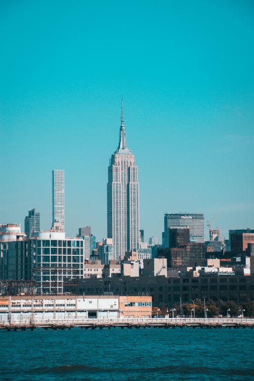 Free Stunning view of the New York City skyline featuring the iconic Empire State Building on a clear day. Stock Photo