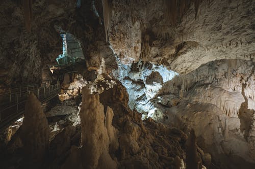 The inside of a cave with many stalagmites