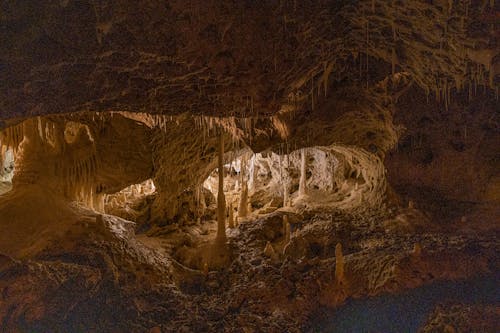 The inside of a cave with a light shining through