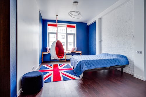 Free Bedroom with Red and Navy Furniture Stock Photo