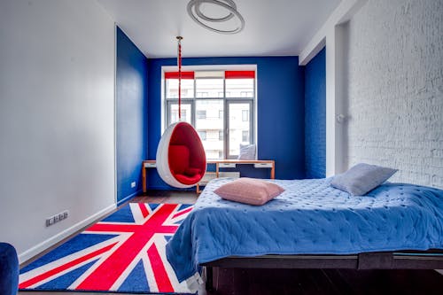 Free A bedroom with a flag hanging from the ceiling Stock Photo