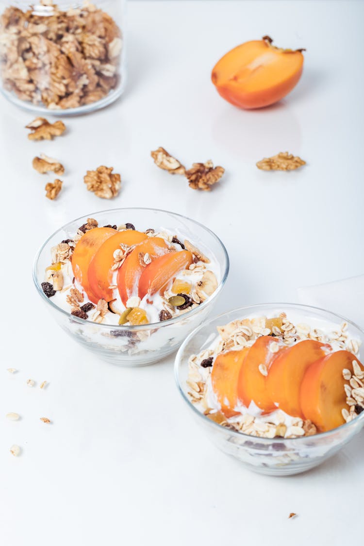 Sliced Fruits In Clear Glass Bowls