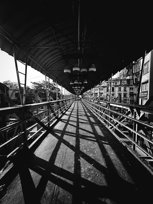 A black and white photo of a bridge