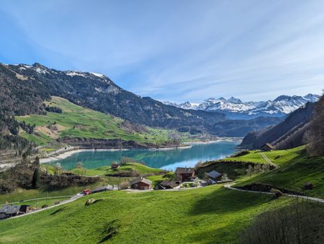 Breathtaking view of Lake Lungern and the surrounding Swiss Alps in summer.