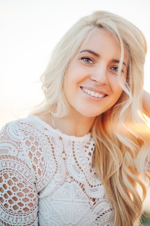 Smiling Woman Wearing White Lace Top