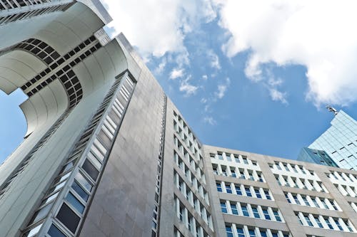 Grey Concrete High Rise Building Under Blue Sky